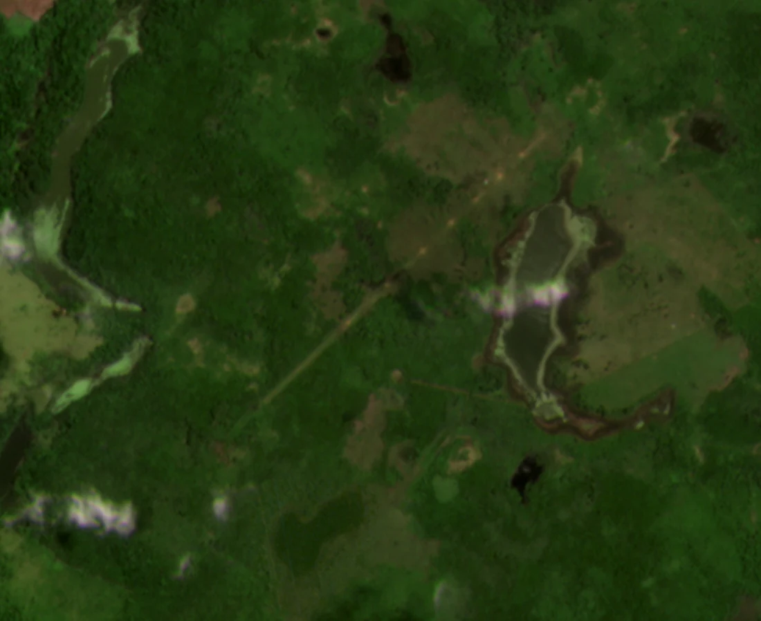 Clandestine airstrip with cratered runway seen from satellite imagery